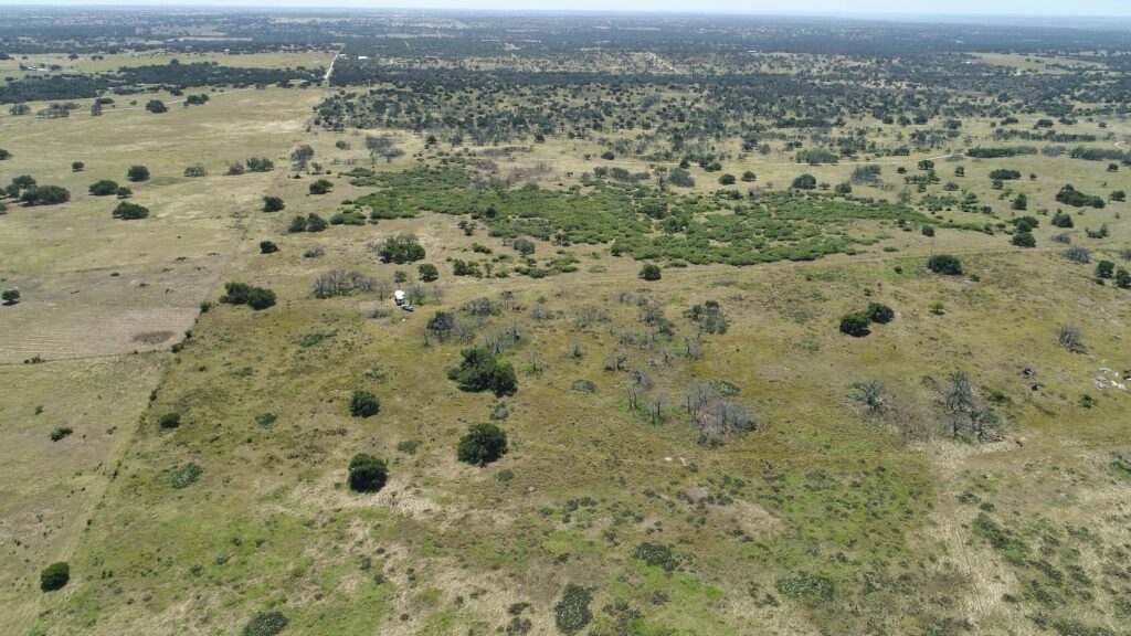 Aerial drone photo of rolling hills at 2112 Turkey Ridge Lane, Harper, TX