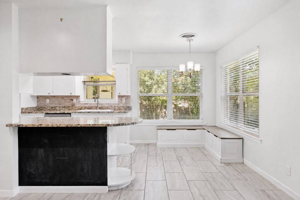 Kitchen with breakfast bar and adjoining breakfast nook