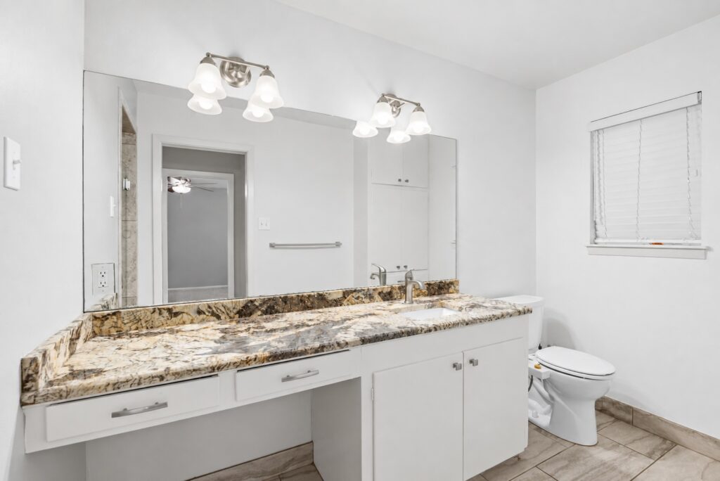 Primary bathroom with granite vanity at 705 Overhill Drive