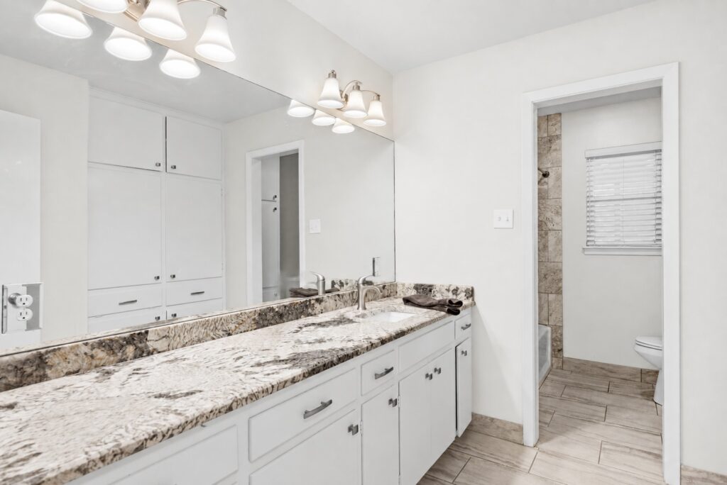 Secondary bathroom with vanity and updated finishes