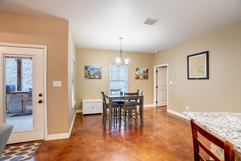 Breakfast area with a door opening to the covered patio at 119 Fannin Drive, Kerrville