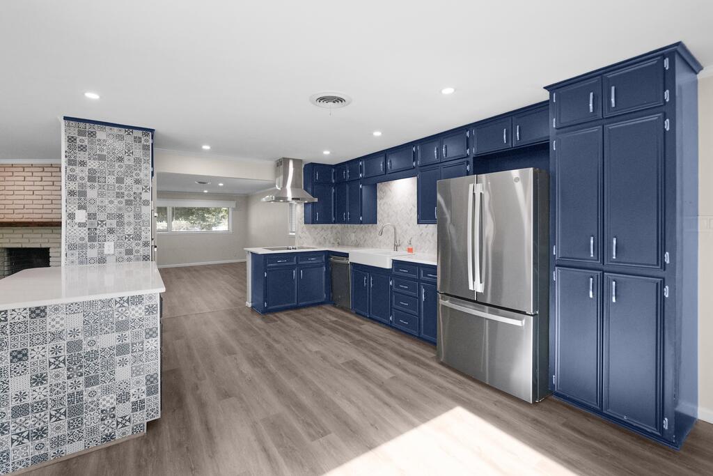 1232 Virginia Drive, Kerrville, TX - kitchen with blue cabinetry